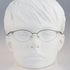It&#39;s Titanium 606, Vintage 90s green laser cut ultra lightweight nylor small cat eye glasses frames women / NOS