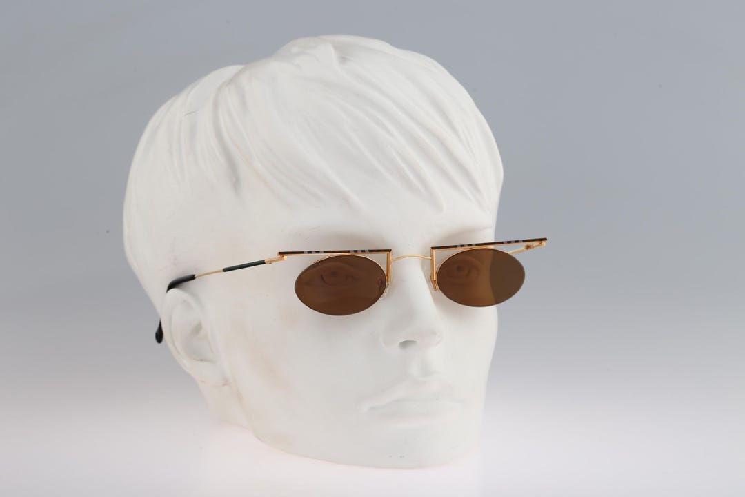 Marque inconnue, petites lunettes de soleil ovales semi-sans