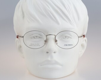 Shiseido 701 2 , Vintage 90s silver unique small oval eyeglasses frames womens NOS