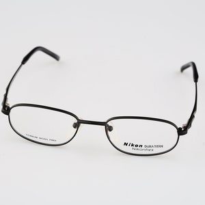 Nikon Dura Titan DT4379 0005 Titanium, Vintage 90s black rectangle eyeglasses frames mens & women NOS