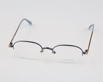 Shiseido 1011 3, Vintage 90s half rim unique oval glasses frames womens NOS