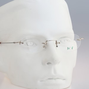 Joy 3839, Vintage 90s unique silver rimless oval eyeglasses frames mens & womens NOS