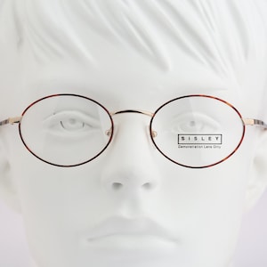 Sisley SLY 308 13M, Vintage 90s gold and tortoise small oval eyeglasses frames mens & womens NOS