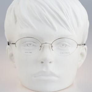 Shiseido 1017 3, Vintage 90s half rim silver small oval glasses frames womens NOS