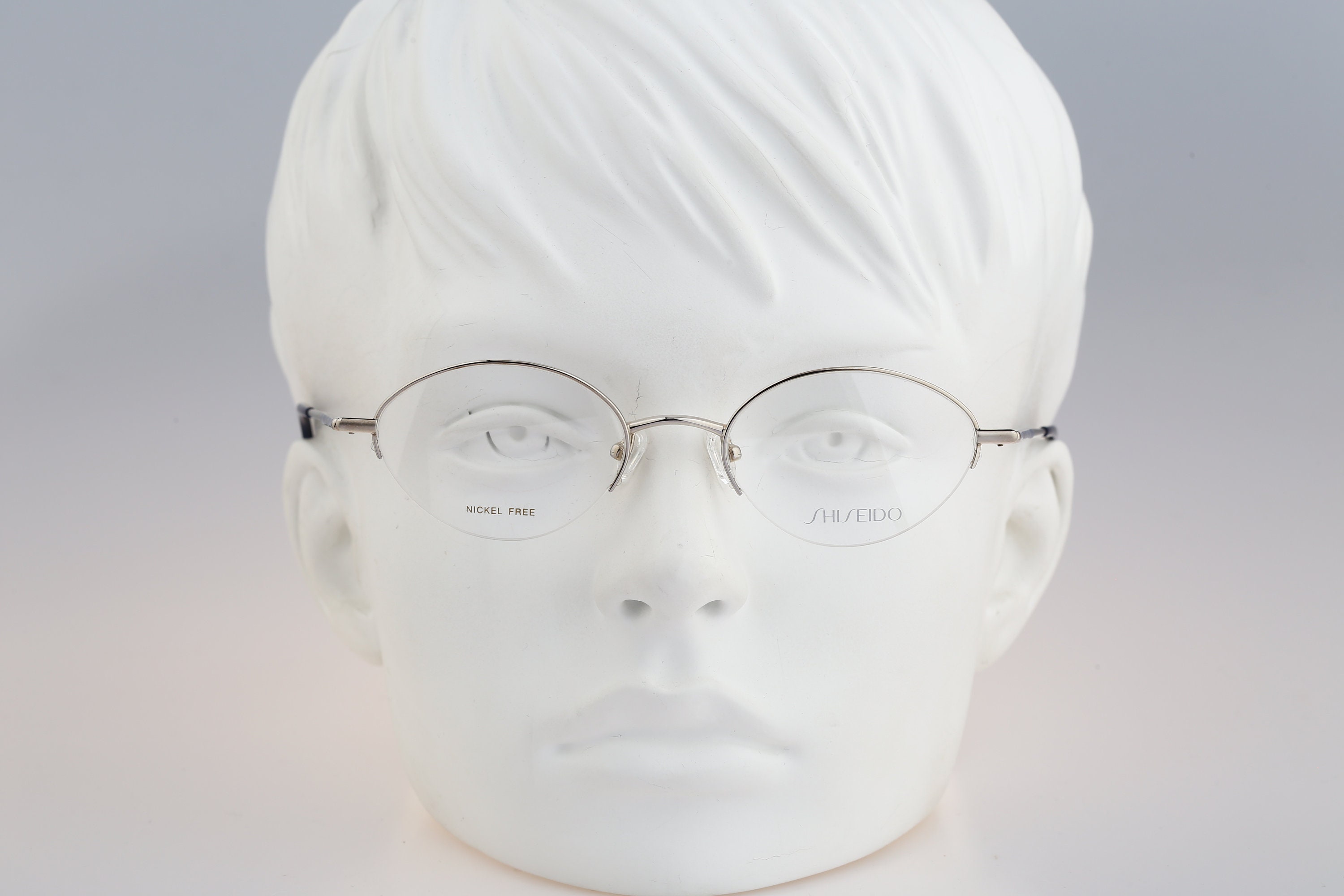Shiseido 1017 3, Vintage 90s half rim silver small oval glasses frames womens NOS