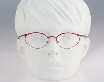 It's Titanium 804, Vintage 90s laser cut ultra lightweight nylor pink small cat eye glasses frames women / NOS