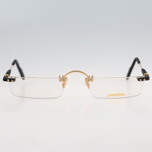 Alpina M1FR 781 3 7813 03, Vintage 90s gold and black rimless slim rectangle reading glasses frames mens & womens NOS