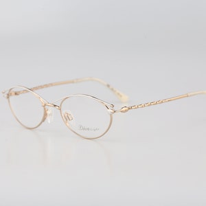 Diva 9032 19, Vintage 90s gold & white browline small oval eyeglasses frames womens NOS