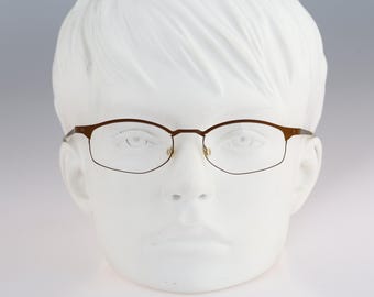 It's Titanium 602, Vintage 90s laser cut ultra lightweight nylor bronze small rectangle glasses frames women / NOS