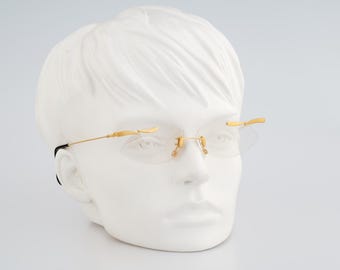 MCS 299 165, Vintage 90s gold crazy rimless small oval eyeglasses frames womens NOS