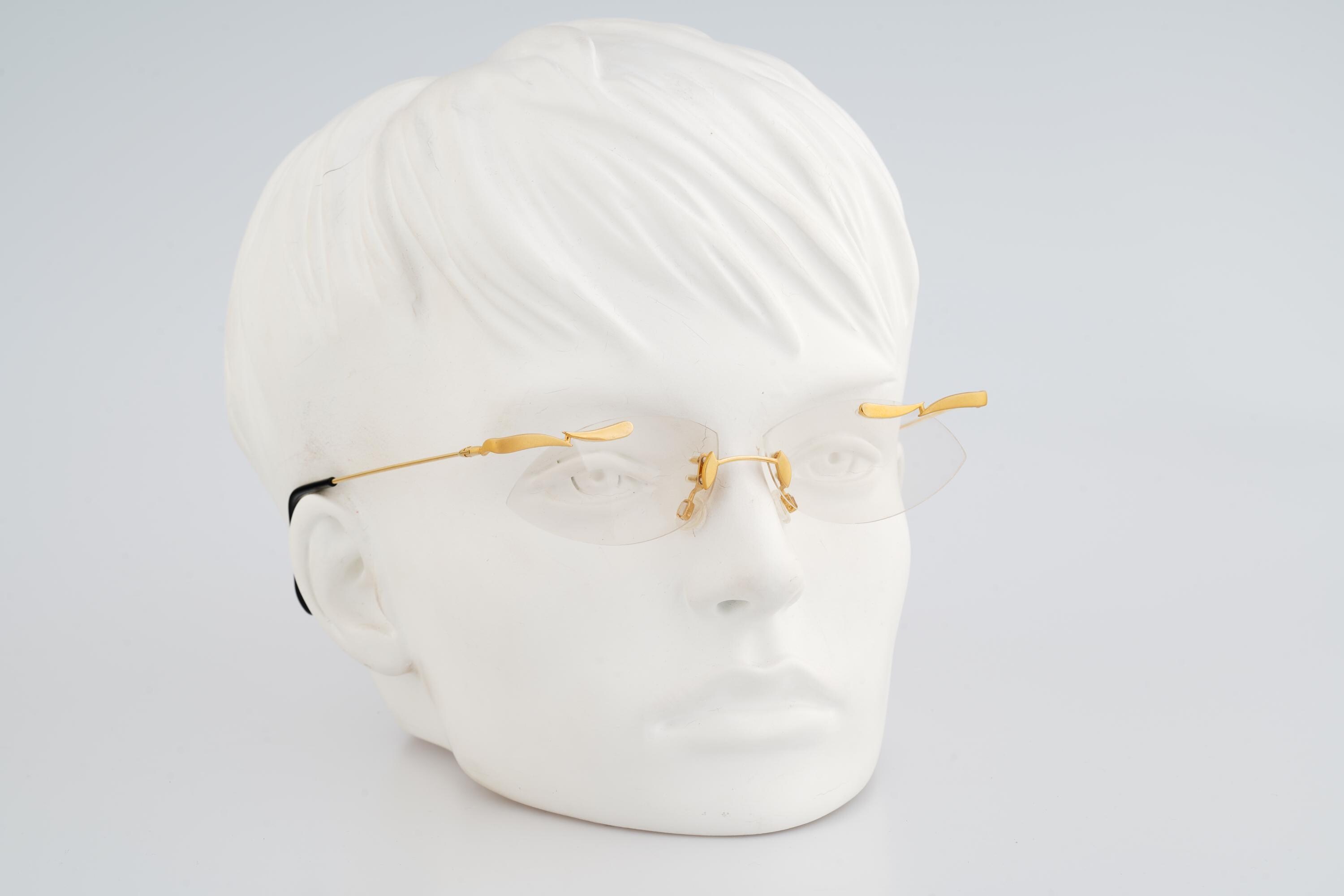 MCS 299 165, Vintage 90s gold crazy rimless small oval eyeglasses frames womens NOS