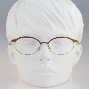 It&#39;s Titanium 603, Vintage 90s laser cut ultra lightweight nylor bronze oval eyeglasses frames women / NOS