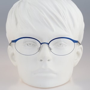 It&#39;s Titanium 603, Vintage 90s laser cut ultra lightweight nylor blue oval eyeglasses frames women / NOS