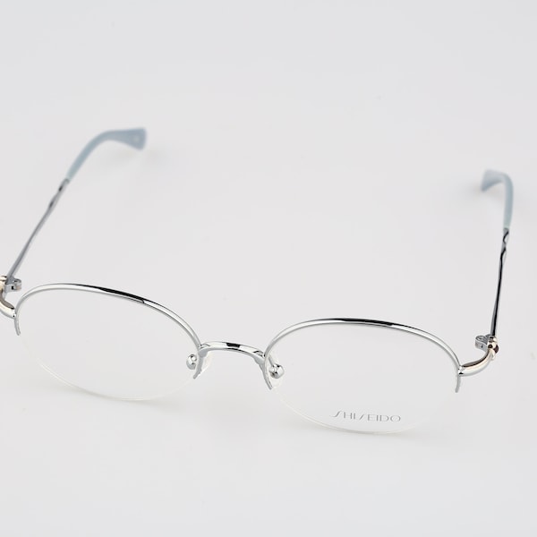 Shiseido 1010 3, Vintage 90er Jahre Halbrand ovale Silber Brille Damen NOS