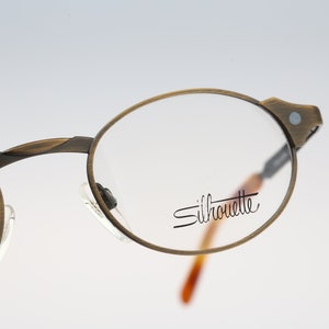 Silhouette M 7247 V 6050, Vintage 90s unique antique gold oval eyeglasses frames womens NOS