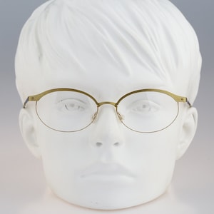 It&#39;s Titanium 603, Vintage 90s laser cut ultra lightweight nylor green oval eyeglasses frames women / NOS
