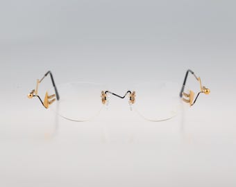 MCS 308 506, Vintage 90s gold and colorful crazy rimless oval eyeglasses frames mens & womens NOS