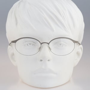 It&#39;s Titanium 603, Vintage 90s laser cut ultra lightweight nylor gray oval eyeglasses frames women / NOS