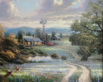 May include: A painting depicting a rural scene with a farmhouse, a windmill, and a red truck. The scene is set in a field of bluebells, with a dirt track leading to the farmhouse. The sky is a soft blue with fluffy white clouds.