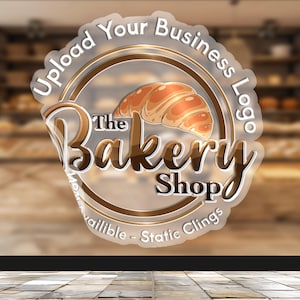 May include: A clear sticker with a gold circle and the text "Upload Your Business Logo" and "The Bakery Shop" with a croissant graphic. The sticker is on a glass door.