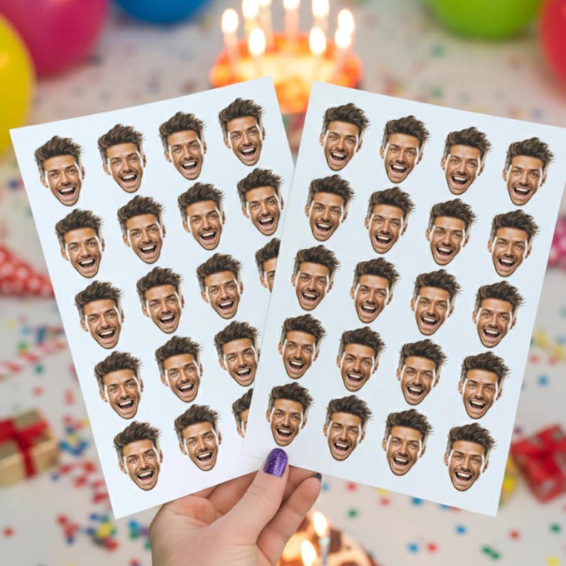 May include: Two sheets of stickers featuring a repeating pattern of a smiling face. The face has dark hair and a happy expression. The stickers are held in a hand with a purple painted fingernail. The background includes birthday decorations.