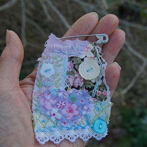 Textile art slow stitched charm brooch - featuring an appliqué heart and a vintage button -  brooch or pin. All hand stitched