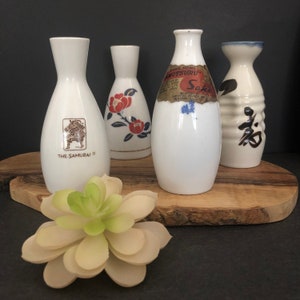 Four Vintage Japanese Porcelain Sake Bottles