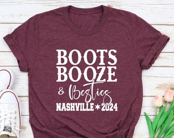 May include: A maroon t-shirt with white text that reads "Boots Booze & Besties Nashville * 2024".