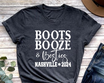 May include: Dark grey heather t-shirt with white text that reads "Boots Booze & Besties Nashville 2024".