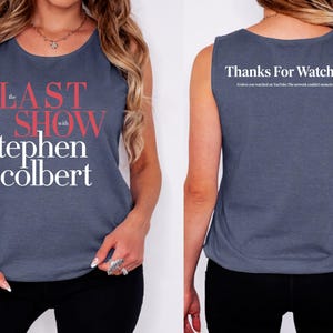 May include: A blue tank top with the text "the LAST SHOW with stephen colbert" in red and white. The back of the tank top says "Thanks For Watching!" in white text.