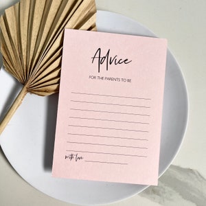 May include: A pink card with the text "Advice for the parents to be" and "with love" written in black cursive.