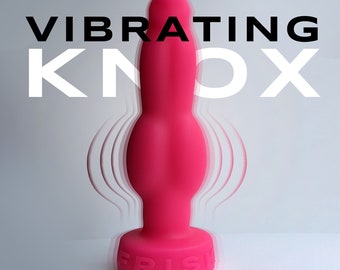Vibrating small knox dildo with a 3" mini vibrating dildo embedded in it.