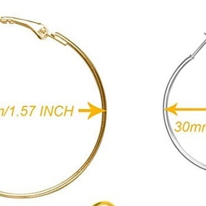 May include: Two pairs of hoop earrings, one gold and one silver. The gold earrings are 1.57 inches in diameter, and the silver earrings are 1.18 inches in diameter.