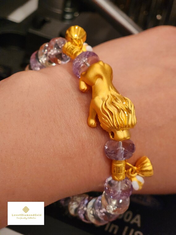 GLASS BEAD RING 2 MM ORANGE W/LION CHARM GLASS BEAD RING 2 MM ORANGE W/LION CHARM