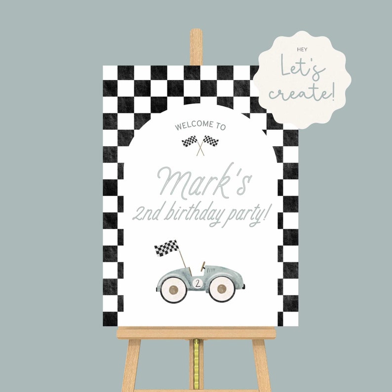 May include: A white welcome sign with a black and white checkered background. The sign says "Welcome to Mark's 2nd birthday party!" with a cartoon race car and checkered flags.