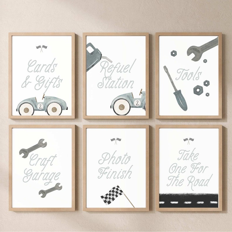 May include: Six framed prints with a racing theme. The prints feature illustrations of cars, tools, and a checkered flag. The text on the prints includes "Cards & Gifts", "Refuel Station", "Tools", "Craft Garage", "Photo Finish", and "Take One For The Road".