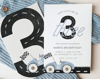 May include: A blue and white birthday invitation with a black and white illustration of a race car and the number three. The text on the invitation reads "Can't Catch Me I'm Three" and "Mark's 3rd Birthday".