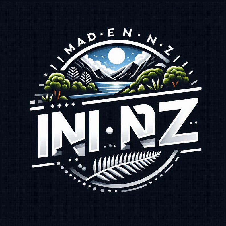 May include: A circular graphic design on a dark background featuring the text MAD E N Z and INI NZ. The illustration depicts a landscape with mountains, a lake, a full moon, green trees, and a silver fern leaf at the bottom, all in a stylized format.