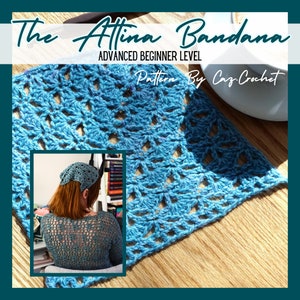 May include: A blue crochet bandana with a lacy pattern. The bandana is laid out on a wooden surface. The text "The Attina Bandana" and "Advanced Beginner Level" is at the top of the image. The text "Pattern by Caz Crochet" is at the bottom of the image.