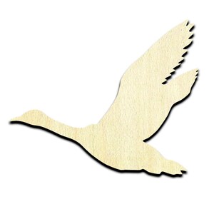 May include: A wooden cutout of a goose in flight. The cutout is a light brown color and has a smooth, unfinished surface.