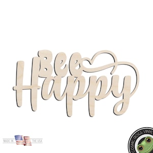 May include: A wooden sign with the words "Bee Happy" in a cursive font. The sign is made of light-colored wood and has a heart-shaped design incorporated into the lettering. The sign is designed to be a decorative item.