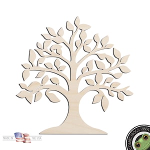May include: A wooden cutout of a tree with a thick trunk and many branches with leaves. The tree is a light brown color and has a simple, elegant design.