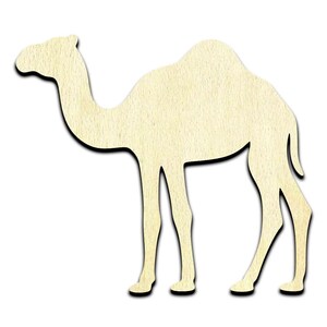 May include: A cutout of a camel, made of light brown wood. The camel is standing with its legs spread apart, and its head is turned to the left.