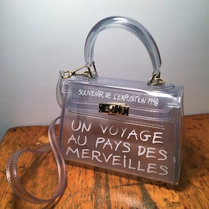 Un voyage au pays des merveilles bag black sale