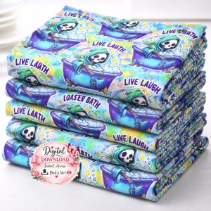 May include: A stack of fabric featuring a cartoon grim reaper in a purple bathtub with bubbles. The reaper wears a green hood and is surrounded by the words "LIVE LAUTH" and "LIVE LAUGH". The background is a mix of blue, yellow, and purple.