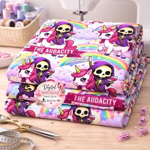 May include: A stack of fabric featuring a whimsical design with a skeleton in a purple robe riding a unicorn, holding a glass of wine, and a scythe. The fabric has a rainbow and cloud background, with the text "THE AUDACITY".