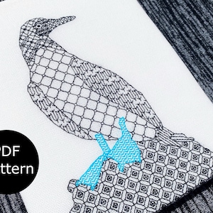 May include: A black and white line art embroidery design of a blue-footed booby bird standing on a rock. The bird's feet are a bright blue color.