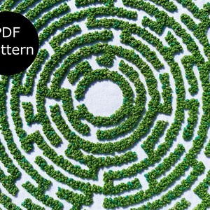 May include: A green and blue circular maze pattern, created with embroidery, on a white background. The text "PDF pattern" is in a black circle at the top left of the image.