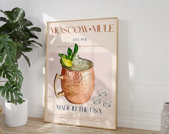 May include: A poster with a pink background featuring a copper Moscow Mule mug filled with ice, a lime wedge, and mint leaves. The text on the poster reads "Moscow Mule Est. 1911 Cocktail Served Statement Copper Mug Made in the USA".