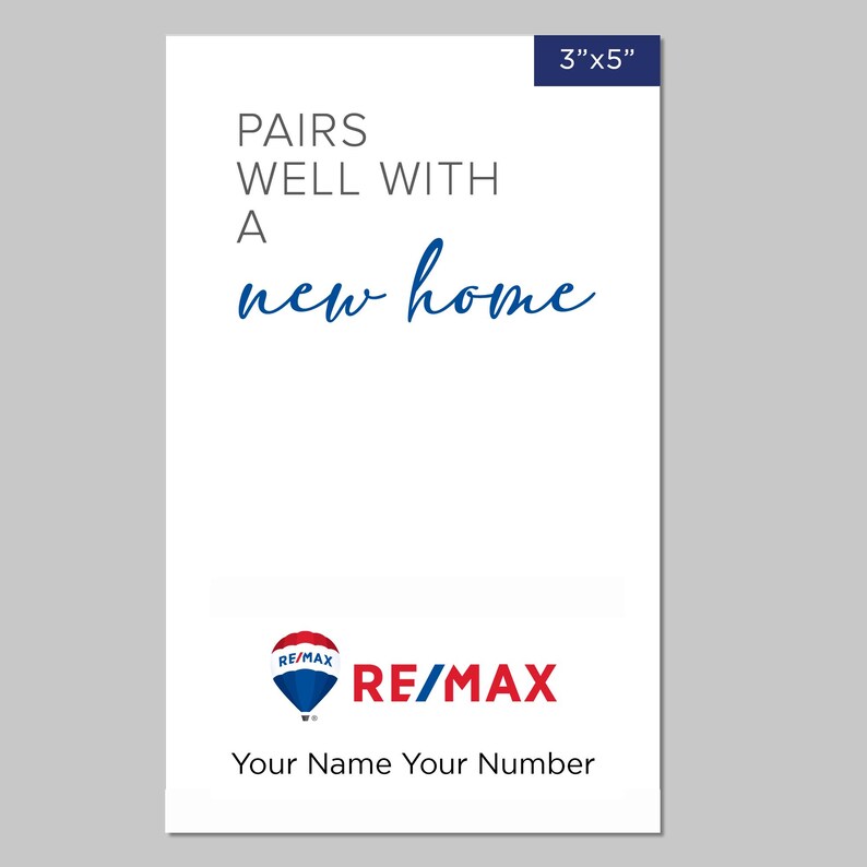 May include: A white 3x5 inch card with blue text that reads "Pairs well with a new home". The card features a red, white, and blue hot air balloon logo with the text "RE/MAX" in blue. The text "Your Name Your Number" is also included in blue.
